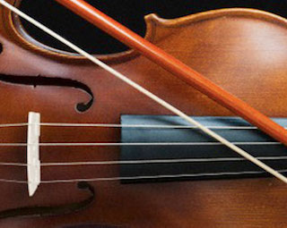 close-up of a violin and bow