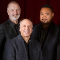 Five members of Alexander String Quartet posing and smiling