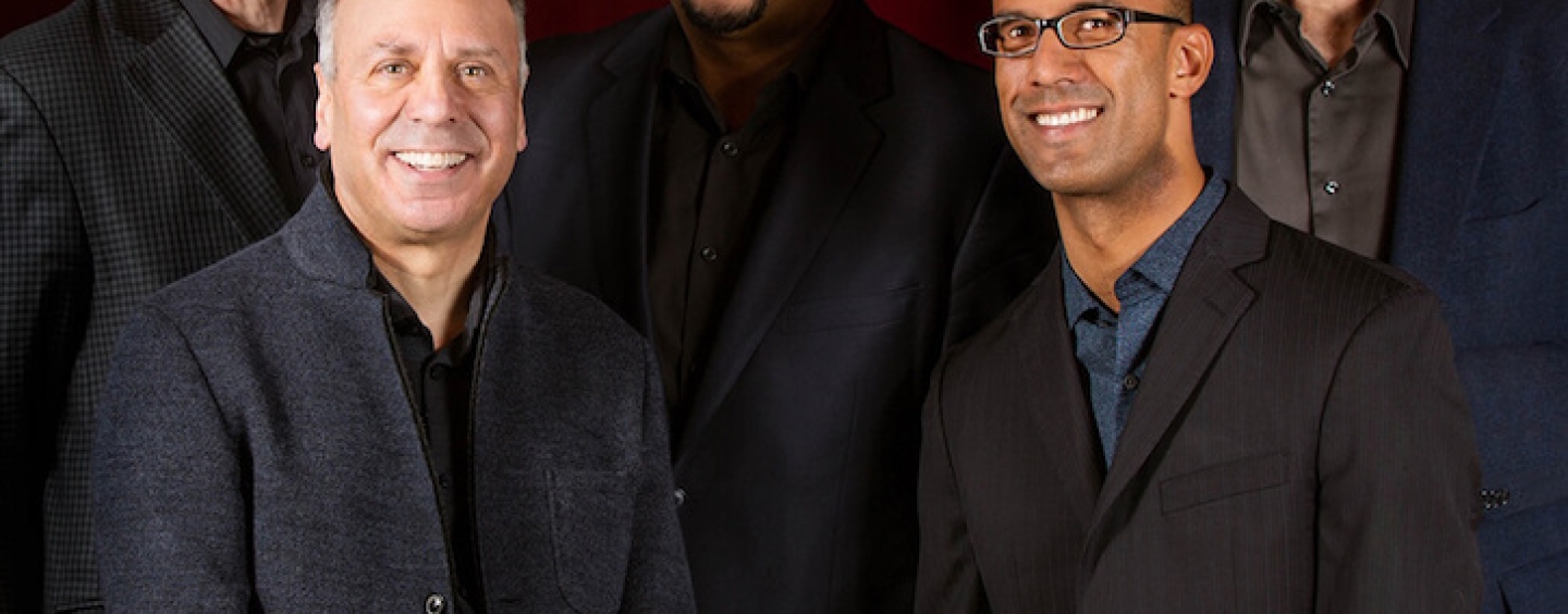 Five members of Alexander String Quartet posing and smiling